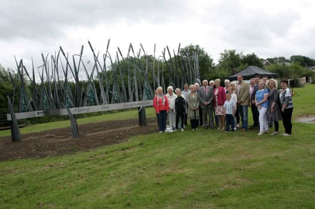 NEW ARTWORK LAUNCHED FOR DRUMAHOE. . .Group pictured at Drumahoe on Monday morning for the launch of a major piece of public art that will ensure the village of Drumahoe is recognised as a location in its own right and not just as a suburb of Londonderry. Included are Deputy Mayor, Alderman Thomas Kerrigan, Alderman Hilary McClintock, Alderman David Ramsey, Lorraine McDowell, Arts Council NI, Andrew Rusell, chair, Drumahoe Community Association, artists Tracey McVerry, Patricia Crossan, Niall Loughran and Gerard Loughran and local residents from the Drumahoe area. INLS2715MC001
