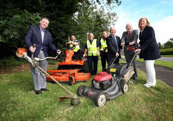 Getting increased grass cutting underway and maintaining  the key gateways in and out of the Lisburn & Castlereagh City Council area with the intention of making sure the area looks neat and tidy are (l-r) Alderman Paul Porter; Trevor Boyd, Jonathan Pauley & Pete Disney; Cllr Brian Hanvey; Alderman Allan Ewart and Director Heather Moore.
