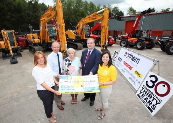 Sophie and Brian Bradford, Northern Lift Trucks, pictured with Doreen and David McShane and Yvonne Craig, from Marie Curie, pictured handing over a cheque for £8,255 to Marie Curie. US1527-534cd  Picture: Cliff Donaldson
