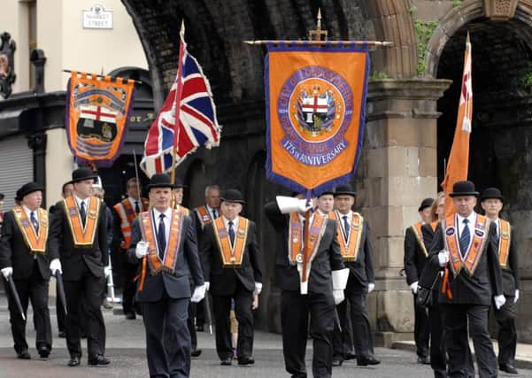 The City of Londonderry Grand Orange Lodge march through Ferryquay Gate in 2012 before leaving for the main parade in Coleraine. INLS2912-170KM