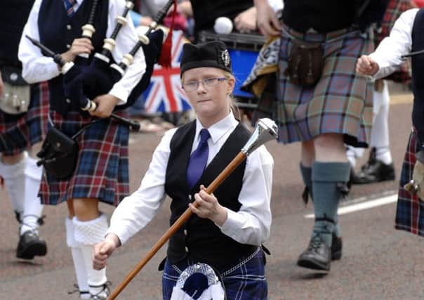 A drum major leading the Kildoag Pipe Band at Coleraine in 2012.