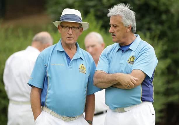 Planning tactics during the match between Lisnagarvey and Musgrave, at Warren Gardens. US1526-546cd  Picture: Cliff Donaldson