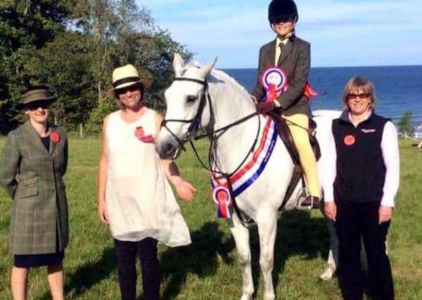 Winner of the Champion of Champions rosette at Larne Horse and Pony was Phoebe Beaumont, on Edie. INLT 28-600-CON