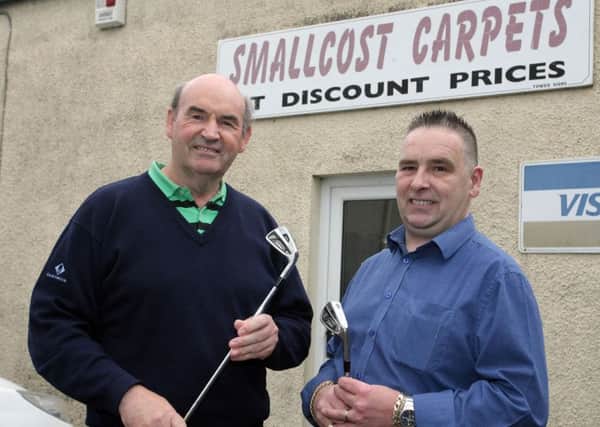 Ken Revie, of Ballymena Golf Club, is pictured with Willard McKeown, of Smallcost Carpets, who sponsored a recent competition at Raceview. INBT27-200AC