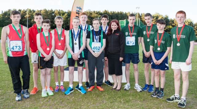 Pictured with Paula Simpson of firmus energy are the teams from Ballymena and Antrim Athletic Club, Rising Stars and City of Lisburn A Athletic Club who came first, second and third respectively in the Under 15 boys 4 x 100m relay.  The team from Ballymena and Antrim Athletic Club consisted of Peter Wright, Rhys McMurray, Daniel Logan and Luke Campbell.