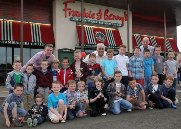 Members of Carniny Youth Football Development Centre pictured at their prize giving at Frankie & Benny's. Included are coaches Paul Porter, David Boyd and Colin Turtle. INBT28-203AC