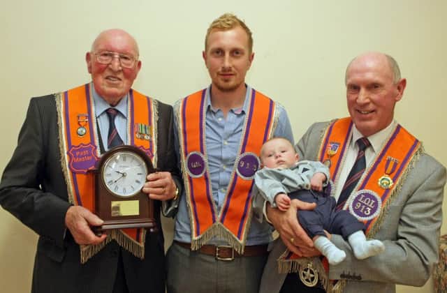 FOLLOW ON. Four generations of the Murphy family, James with his son Ian, Grandson John and Great Grandson George at the presentation ceremony on Thursday night.INBM27-15 107SC.