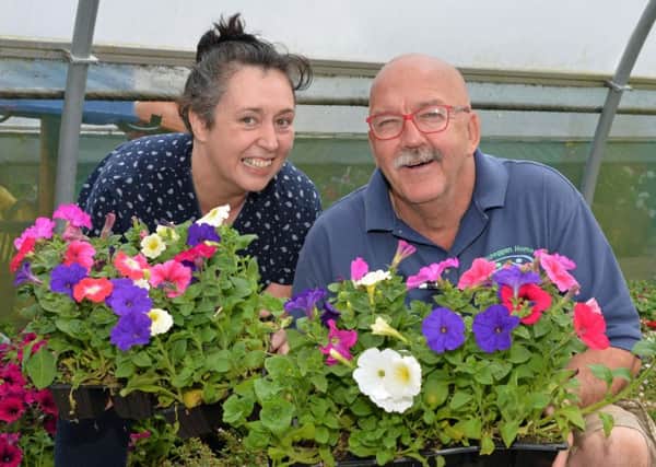 Pauline Brady, organiser of the open day at Kilcreggan Urban Farm is pictured with chief horticulturalist, Philip Hodges. INCT 27-008-PSB