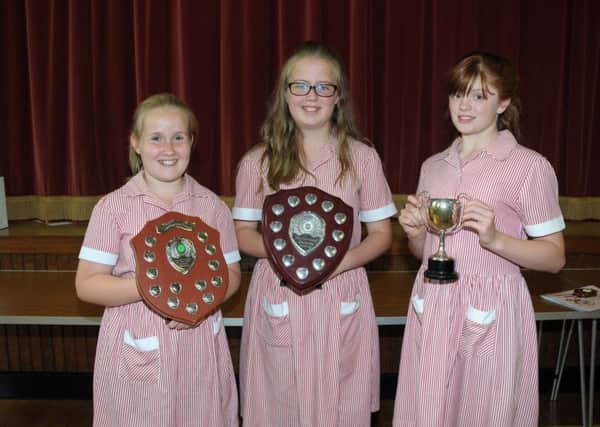 Daisy Johnston, Emma Irvine and Lara Crooks with trophies for Hockey and Sporting Endeavour. INCT 26-212-AM