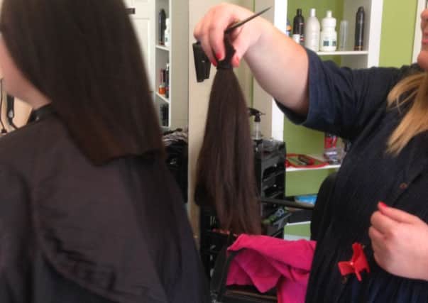 St Mary's student, Saoirse Cawley, gets her hair cut by Jayne Kelly of Shauneen & Jayne's Hair Salon in Lurgan.