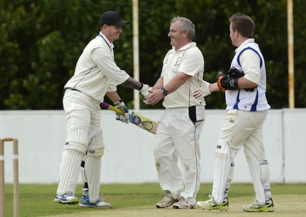 Creevedonnell professional Jean Symes is sportingly congratulated by Burndennett players after his 223 against them on Saturday. INLS2715-133KM