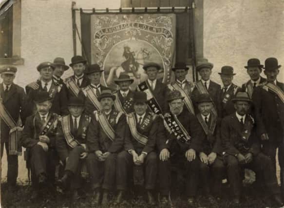 Members of Islandmagee LOL 1962 are pictured in front of their banner.   INCT 27-730-CON
