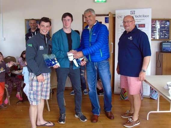 Winners Ballyholme Yacht Club receive their prize from Gavin Smyth managing Director of Autozone the main sponsors.