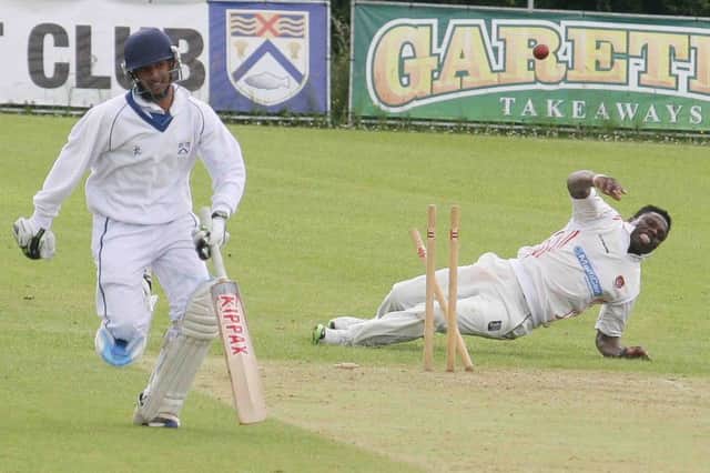 Kylin Vardhan, of Coleraine makes 50 as he runs to the crease in time against Strabane.PICTURE MARK JAMIESON.