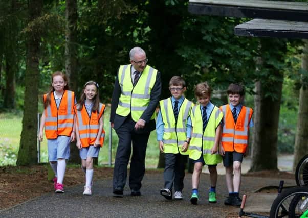 Waringstown Primary School Transport Minister Danny Kennedy announced the winners of the recent Travelwise NI My Walk to School competition.  Fifteen schools from across Northern Ireland were named as the winners in the sustainable transport initiative which took place during Walk to School Week 2015. Schools in Northern Ireland registered to take part in Walk to School Week and all primary schools were asked to encourage pupils, parents and teachers to get active and to take part in a competition to be in with the chance of winning high Viz vests for all pupils in the school.