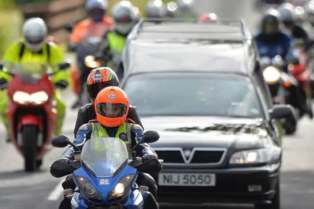 Pacemaker Press 7/7/2015
Dr Fred MacSorley and Dr John's Partner (Janet) leads the Cortege , As Motorcyclists pay tribute to the late road racing doctor John Hinds on Tuesday by riding with his cortege during a lap of the Tandragee 100 course, Which was his favourite road racing circuit . The well-known 'flying doctor' died on Saturday following a crash during a practice session at the Skerries 100 in the Republic of Ireland. Dr Hinds was a intensive care consultant and anaesthetist at Craigavon Hospital in Co Armagh but frequently attended road races to provide medical cover.
Pic Colm Lenaghan/Pacemaker