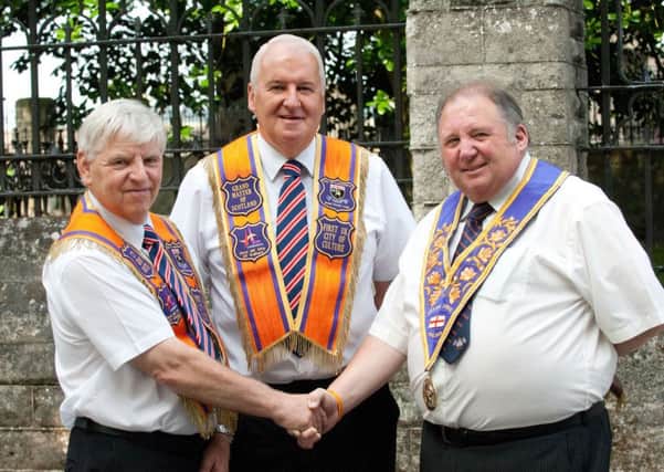 James Hetherington, left, City Grand Master, City of Londonderry Grand Orange Lodge, welcoming Henry Dunbar, centre, Grand Master for Scotland, and Ron Bather, Grand Master for England and Imperial Grand Master, to the city.
