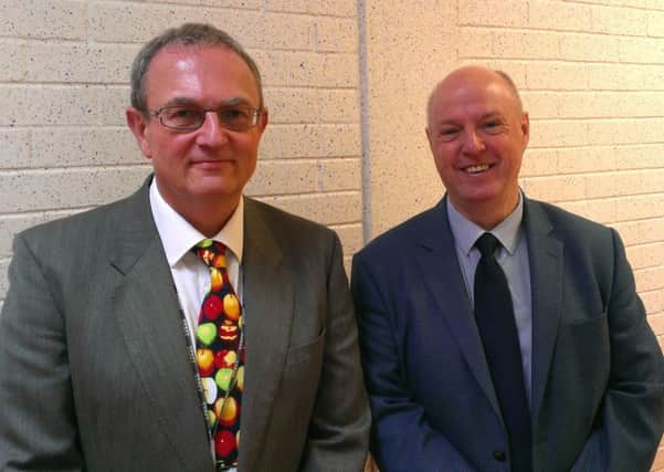 Moving on: Nigel Pell-Ilderton (left) and Raymond Leeman at Monkstown Community School. INNT 27-524CON