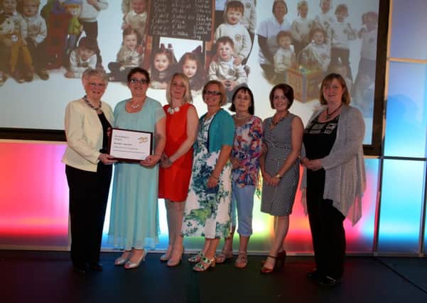 Staff from Little Acorns Playgroup receive their accreditation at the Early Years ceremony in Belfast.
