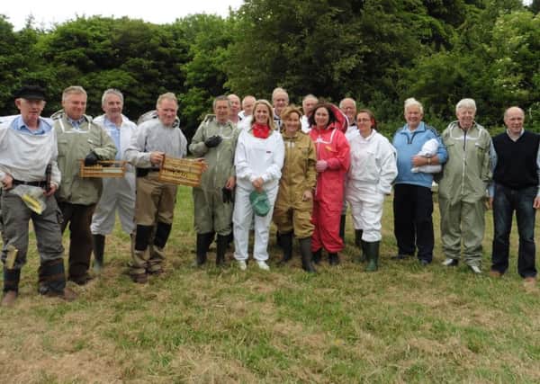 Tullamore honey bee breeder John Summerville (extreme left) with his team and  visitors from Dromore Beekeepers Association.