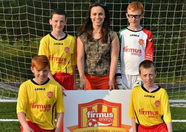 Pictured with Angeline Murphy of firmus energy are (front) Jerome Travers - Rathfriland, Josh Jennings -  Dromore Amateurs. Back: Adam Jennings - Dromore Amateurs, Brendan Tumility - Rathfriland.
