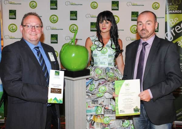 Martyn Boyd (left) and Jasen Upritchard (right) receive their certificates at the Green Apple Awards in London. INNT 29-500CON Pic by Gary Wolens