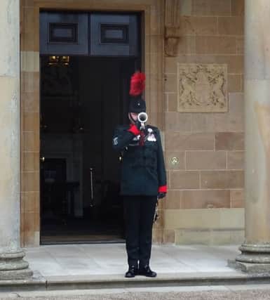Bugle Major Gary Freeland of 2 Rifles sounds The Last Post at Hillsborough Castle in Northern Ireland