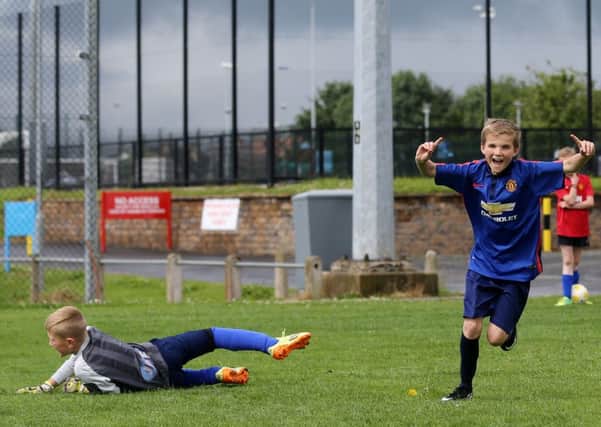 Corey McMillen celebrates after scoring a goal at the IFA Nutty Krust Summer Camp. INBT 29-178CS