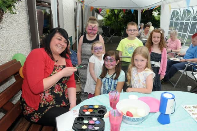Children have their faces painted at Cherrytree Nursing home fun day. INCT 27-211-AM