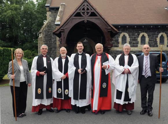 At the Institution of the Rev Jason Kernohan in Eglantine Parish, Lisburn on Thursday 9th July are L to R:  Alberta McCutcheon (Peoples Churchwarden), Canon Sam McVeigh, Canon John Budd, Rev Jason Kernohan, Archbishop Robin Eames, Very Rev John Bond (Dean of Connor) and Geoffrey Simpson (Rectors Churchwarden).