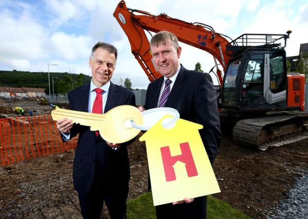 Social Development Minister Mervyn Storey (right) with Michael McDonnell of Helm Housing at the site of the new social housing scheme in Deerfin Park, Rathcoole. INNT 29-502CON