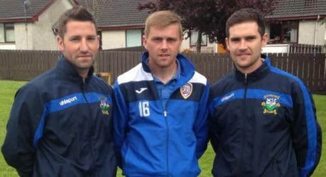 Glebe Captain William Beckett and Vice Captain Peter Kennoway pictured with Coleraine FC's Ian Parkhill