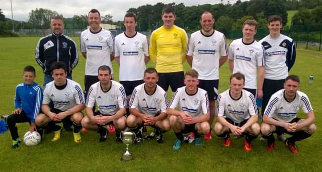 The Rathfriland Rangers squad with the Peter Corrigan Memorial Cup after their 4-1 victory over competition hosts Castlewellan Town in the final.