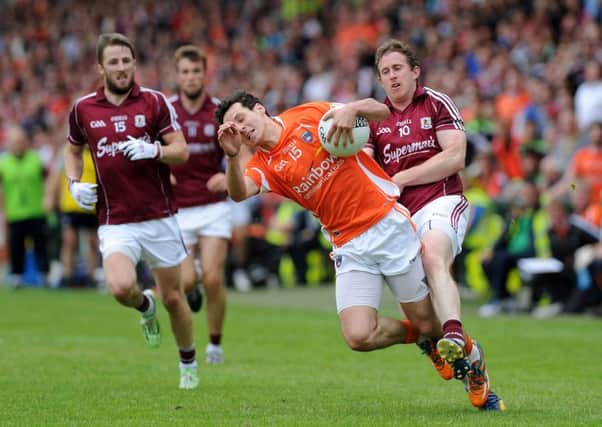 Armagh's Jamie Clarke is challenged by Galway's Gary Sice.