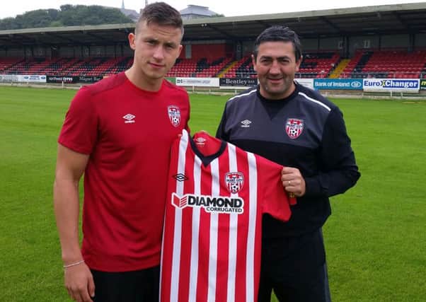 New Derry City signing Rob Cornwall pictured with boss Peter Hutton.