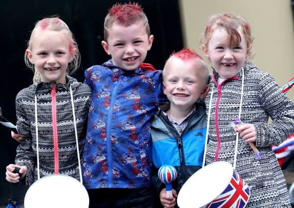 12TH JULY 2015 MCAULEY MULTIMEDIA - Northern Ireland.. The Twelfth of july celebrations are underway across Northern Ireland, Crowds Gather in Coleraine at the Co Londonderry Parade.. Brooke Haywood, Jack Turner, Lucy Turner and Codie Haywood.. Pic Steven McAuley/McAuley Multimedia