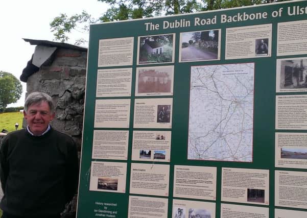 Ian Glendinning, chairman of Megargy Conservation Society, beside the history board for The Dublin Road.