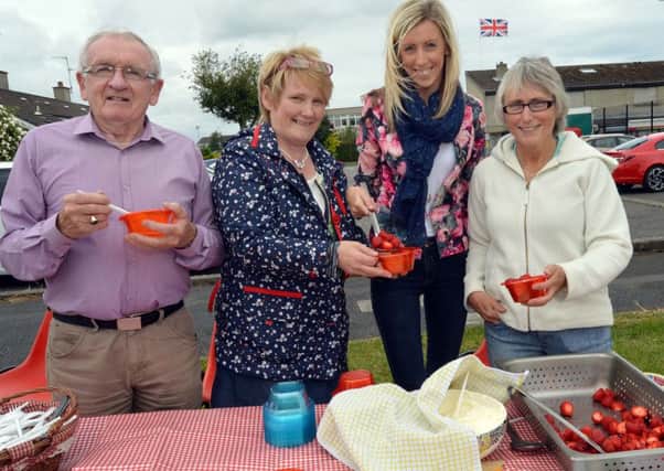 Creme Freche...Councillor Carla Lockhart, second from right, pictured at her Strawberries and Cream event at Mournview Estate in aid of the Northern Ireland Children's Cancer Fund, with from left, Cedric law, Valerie Lockhart and Roberta McNally. INLM29-212.