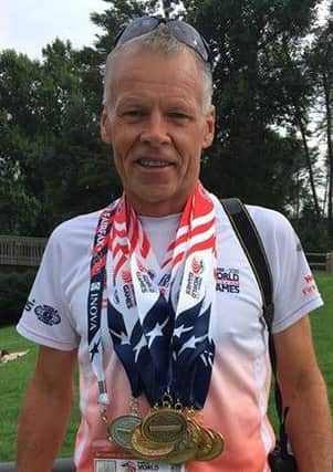 Gary Davison shows off his medals from the World Police and Fire Games in Fairfax, USA. INLT 28-945-CON