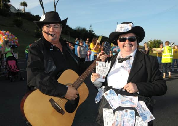 Garth Brooks never made it to Dublin but he turned up in Carnlough along with his agent in the form of Mary McCourt and Maria Donnelly at the Antrim Coast Lion's Club Annual Carnival  INLT 32-213-AM