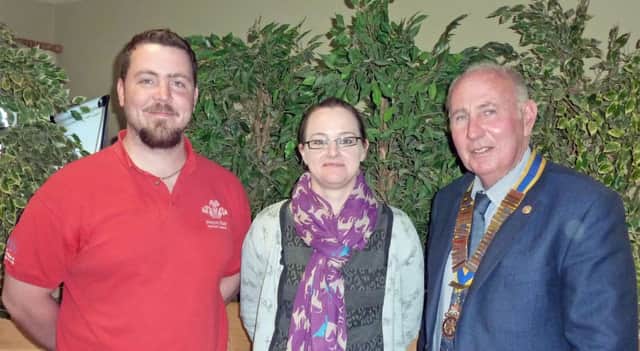 Stewart Cheshire and Susan Duncan, of the Princes Trust, with Sam Crowe, outgoing president of Carrickfergus Rotary Club. INCT 28-796-CON