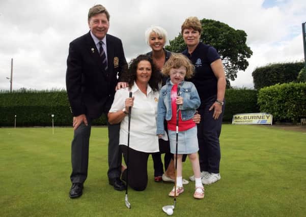Young Jessica Philpott along with her mother Julie Philpott, are pictured at Ballymena Golf Club along with Tracey Hughes (charity event organiser), Captain Henry Eagleson and Lady Captain Elizabeth Anderson. INBT30-201AC