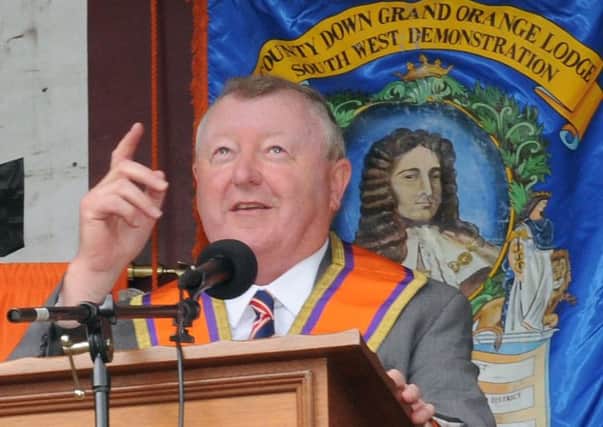 Rt Wor Bro Drew Nelson (Grand Secretary of the Grand Orange Lodge of Ireland) pictured pointing out looming dark clouds while proposing the resolutions at the Twelfth in Laurencetown.
