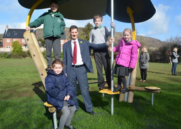 Dermot Breen with Greenisland PS pupils John Glass, Spencer McGregor, Pheobe Thompson and Zoe Wilson during the opening of a playpark in memory of Jacqui Breen. INCT 13-051-GR
