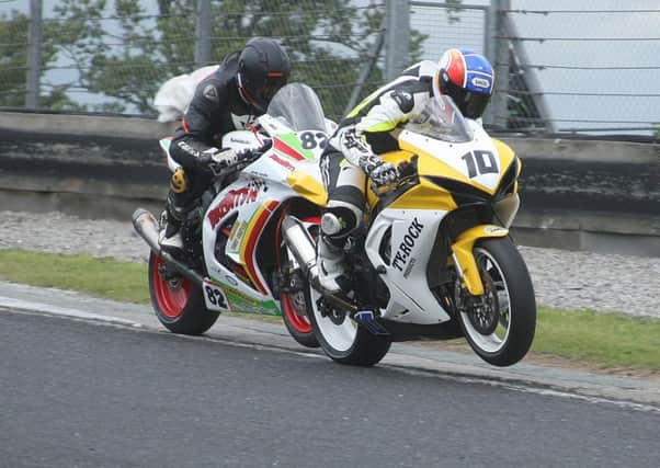 Jamie Patterson holds off Derek Sheils in the Superbike race. Picture: Roy Adams.