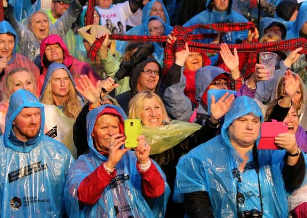 Bay City Roller fans brave the rain to watch Les McKeown's band perform,as the headline act on  the first day at the Dalriada festival at Glenarm Castle..Picture: Paul Faith INLT 30-628-CON