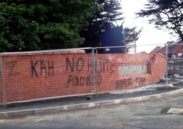 Sectarian graffiti was painted on the wall at the entrance to the new social housing development on Mill Road on July 12. It has since been removed. INNT 30-519CON