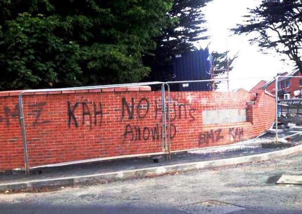 Anti-Protestant graffiti was painted on the wall of the new housing development at Mill Road last month.