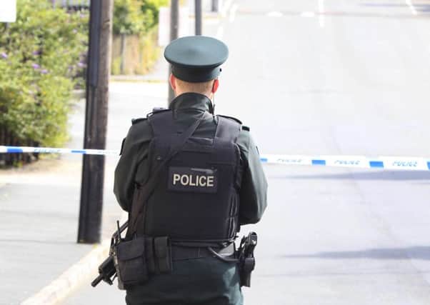 Pacemaker Press 19/7/2015
Police and ATO at the scene of a security alert in Lurgan at the weekend.  
A device exploded in the Victoria Street area of the Co Armagh town late on Saturday night.

During a lengthy security alert in the town police had earlier found a device incapable of exploding.

While carrying out a clearance operation a second device exploded.

Pic Pacemaker