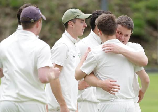 Derriaghy players celebrate after Mark Stinson bowls out Academy's opening batsman. US1529-506cd  Picture: Cliff Donaldson